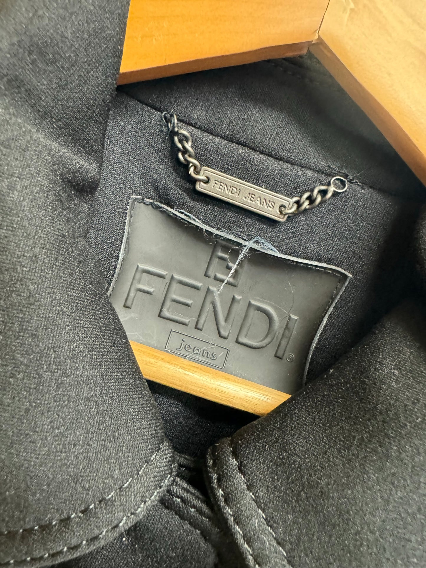 Close-up of the label inside a Vintage Fendi Black Long coat